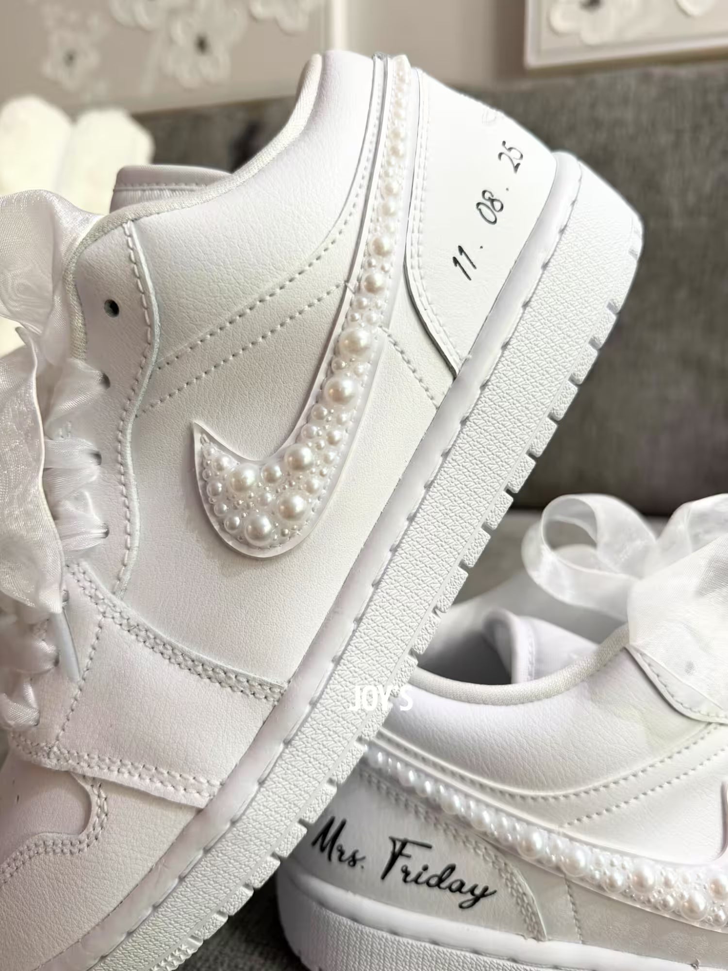 White wedding Jordan sneakers embellished with rhinestones, pearls, and subtle bling details