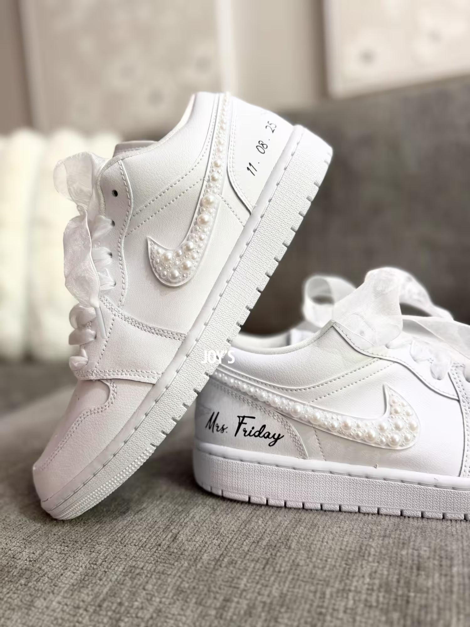 White wedding Jordan sneakers embellished with rhinestones, pearls, and subtle bling details