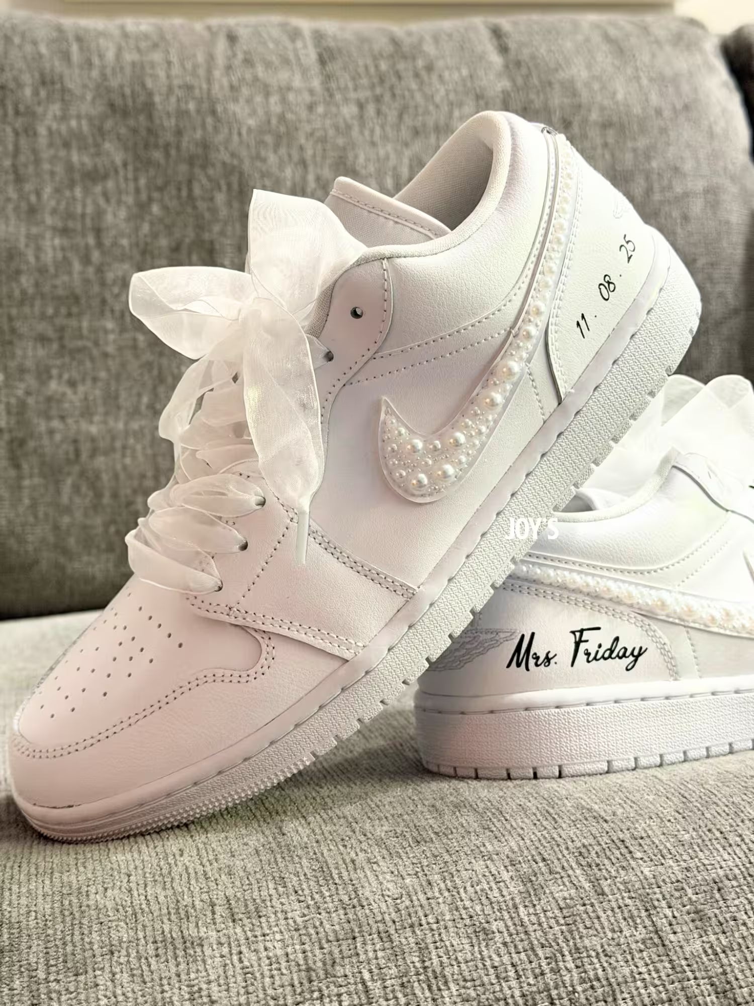 White wedding Jordan sneakers embellished with rhinestones, pearls, and subtle bling details