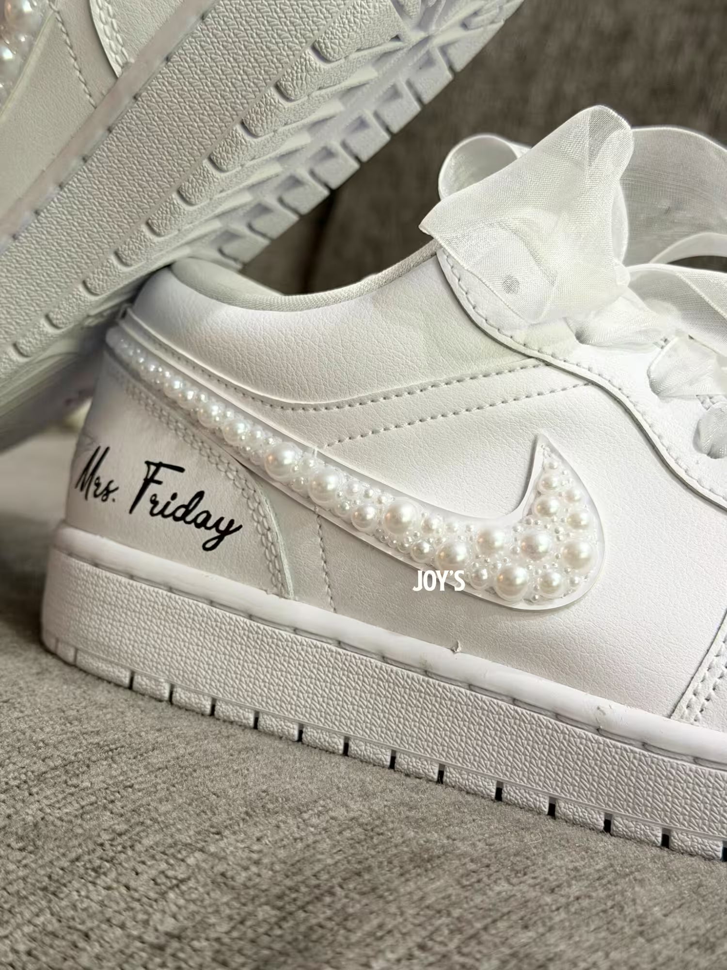 White wedding Jordan sneakers embellished with rhinestones, pearls, and subtle bling details