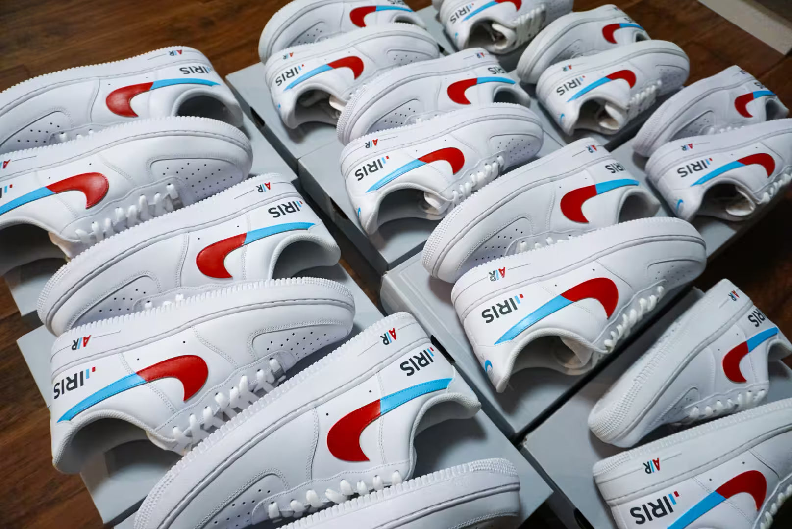 Multiple white slides with red and blue accents arranged on a wooden floor.