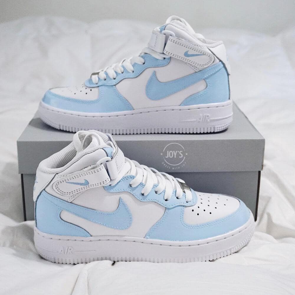 White and baby blue Air Force 1 Mid sneakers displayed