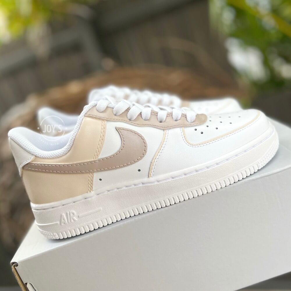 White Nike Air Force 1 Low with beige and cream color block panels.