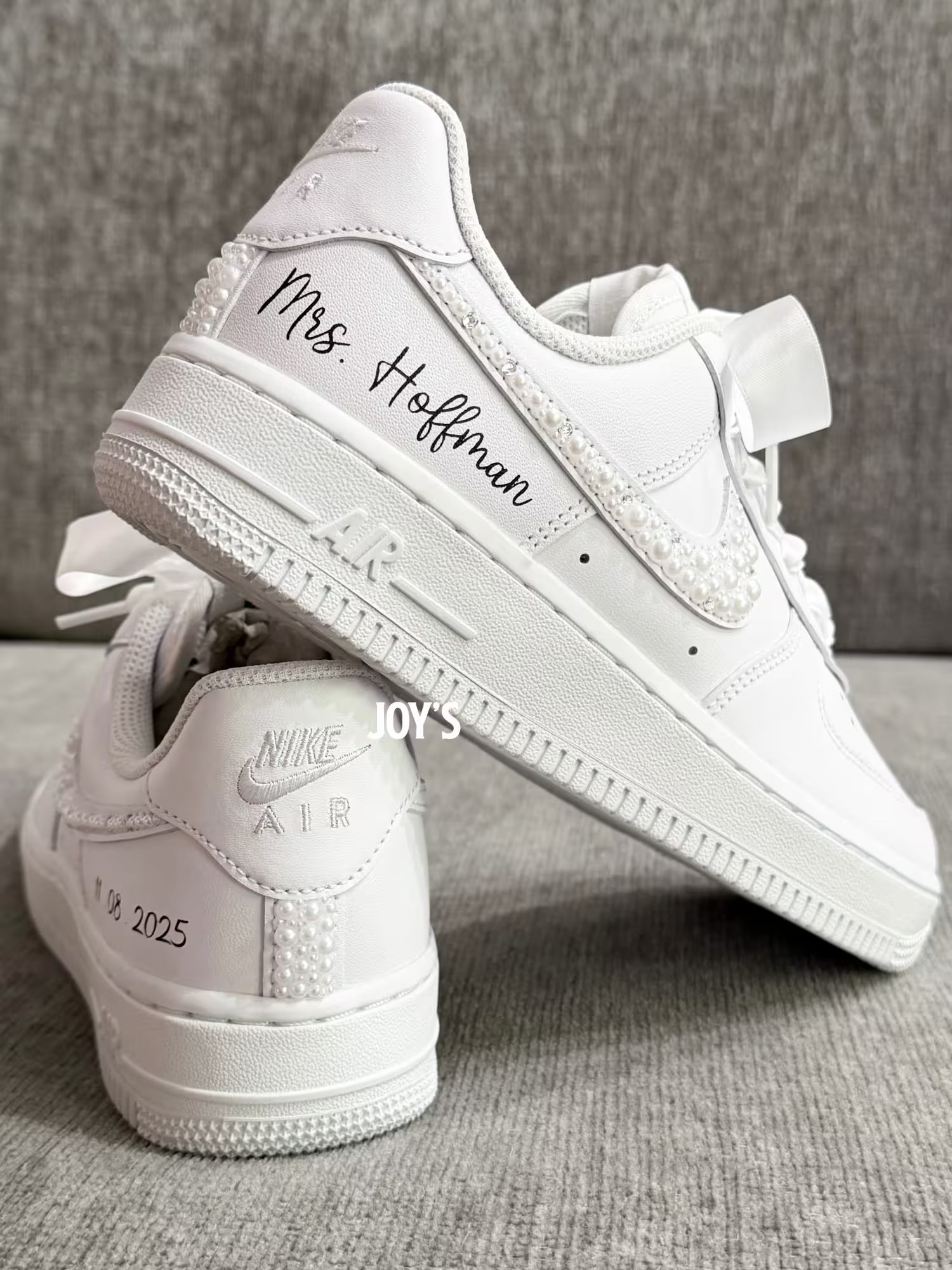 White wedding sneakers embellished with rhinestones, pearls, and subtle bling details