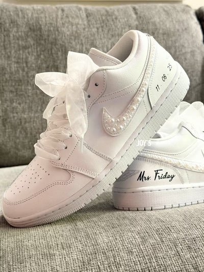 White wedding Jordan sneakers embellished with rhinestones, pearls, and subtle bling details