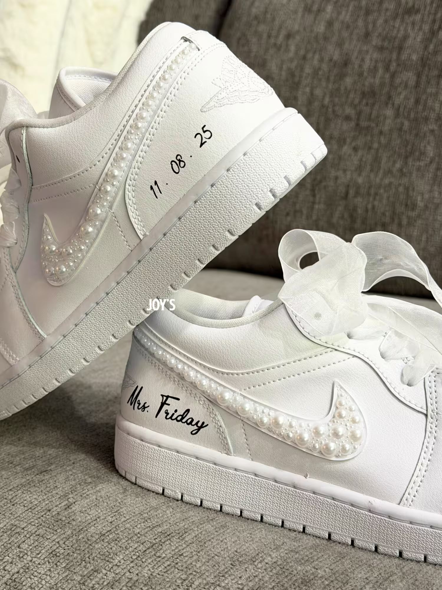 White wedding Jordan sneakers embellished with rhinestones, pearls, and subtle bling details