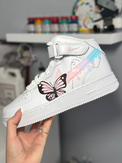 Custom white Nike Air Force 1 sneakers , featuring hand-painted butterfly designs and pastel drip swooshes in peach, lavender, and light blue.