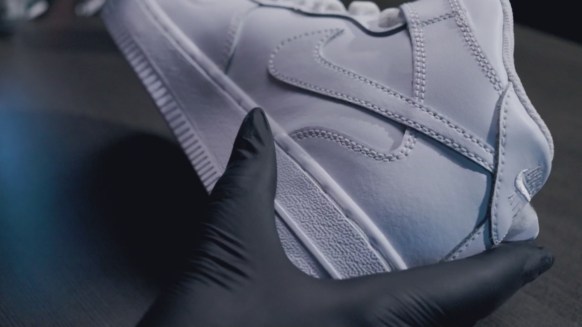 Load video: Custom Sneakers being painted